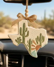 Handmade Texas cactus car freshie scented aroma bead air freshener shaped like a green cactus over the state of Texas, hanging from a car rearview mirror with a western country boho southwest style.