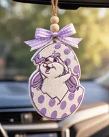 Handmade Easter bunny egg car freshie air freshener made of pastel scented aroma beads hanging from a car rearview mirror.