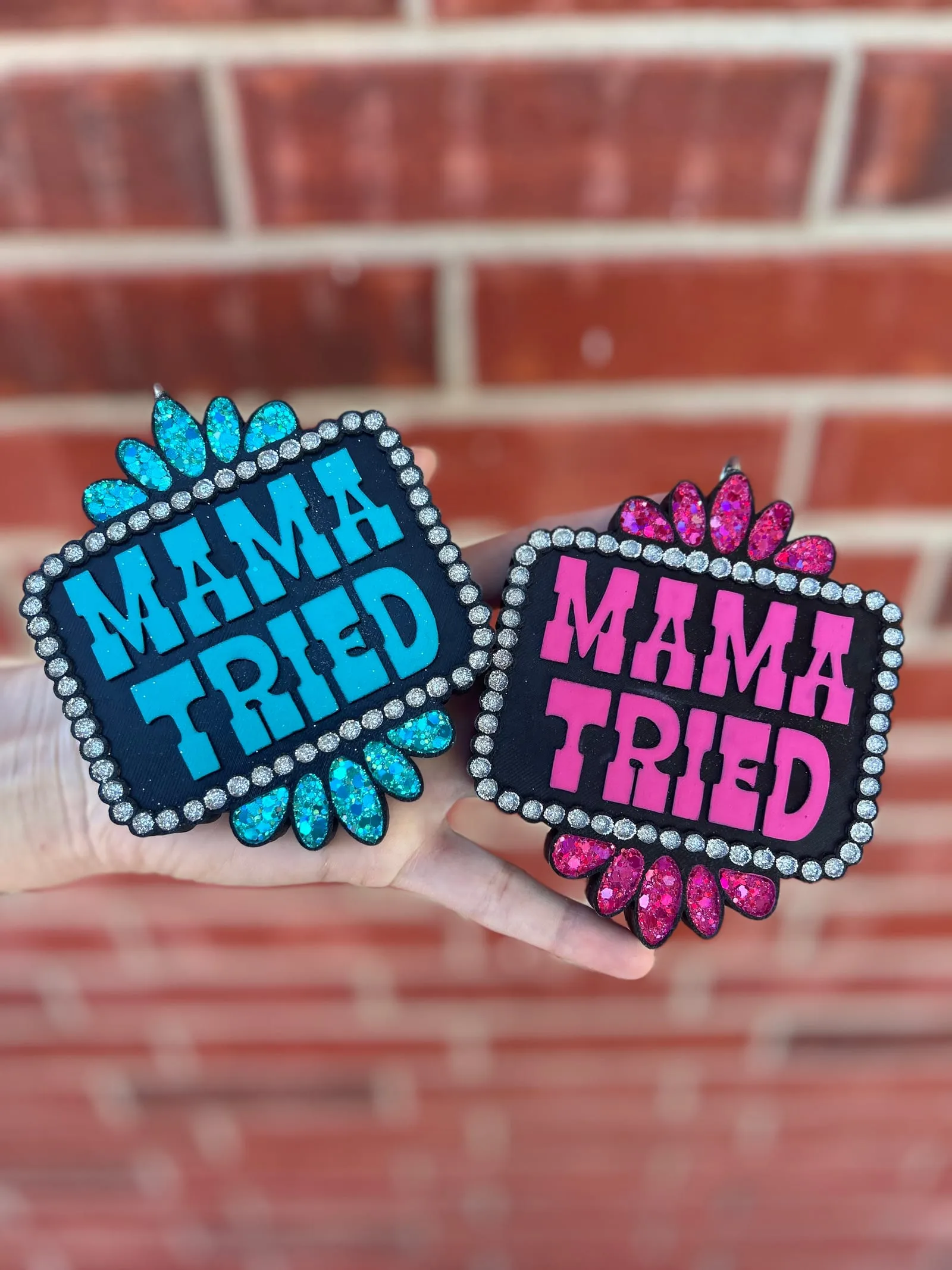 Handmade scented aroma bead car freshie air freshener with bold MAMA TRIED block letters framed by a silver rhinestone border and teardrop gem corners in a western cowgirl bling style.
