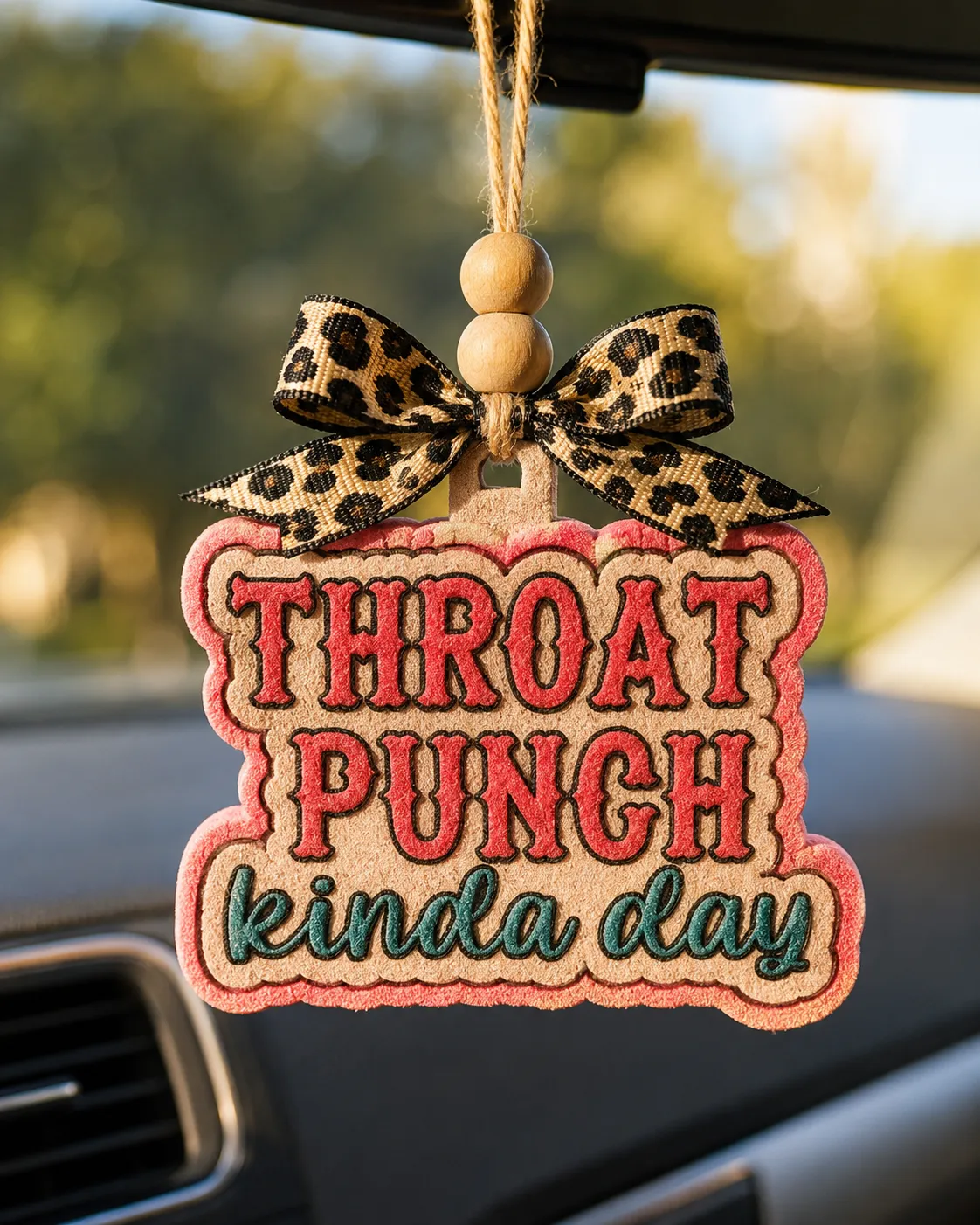 Handmade boxing-glove shaped scented car freshie with funny "Throat Punch Kinda Day" text, a sarcastic aroma-bead car air freshener hanging from a rearview mirror.
